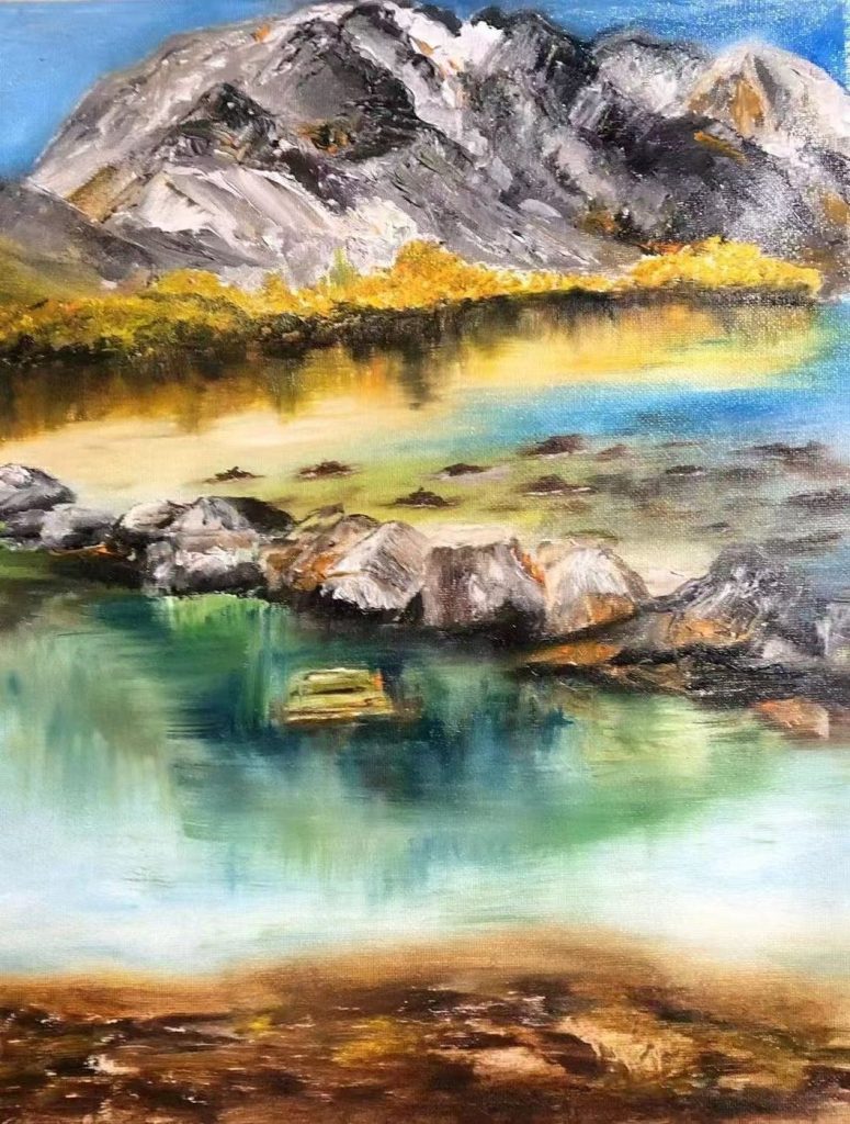 Adult student painting of mountains reflected in a lake